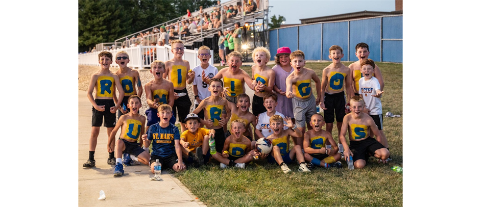 Youth cheering on their soccer buddies!